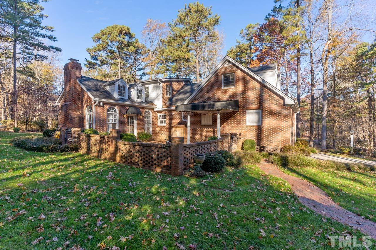 300 Dunstable Court Raleigh, NC 27614 - Photo 4 of 21 a view of a big yard with plants and large trees