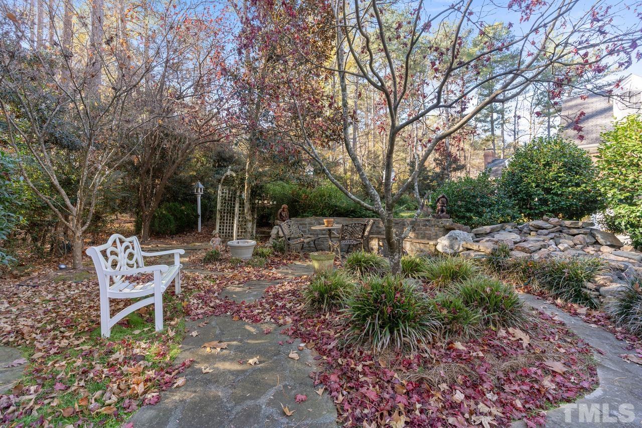 300 Dunstable Court Raleigh, NC 27614 - Photo 6 of 21 a backyard of a house with table and chairs