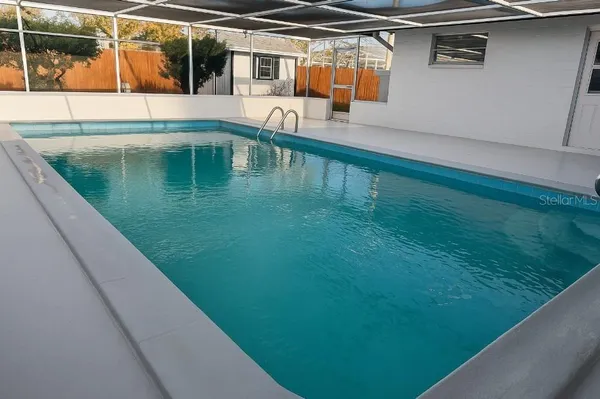 a view of a backyard with a lake view