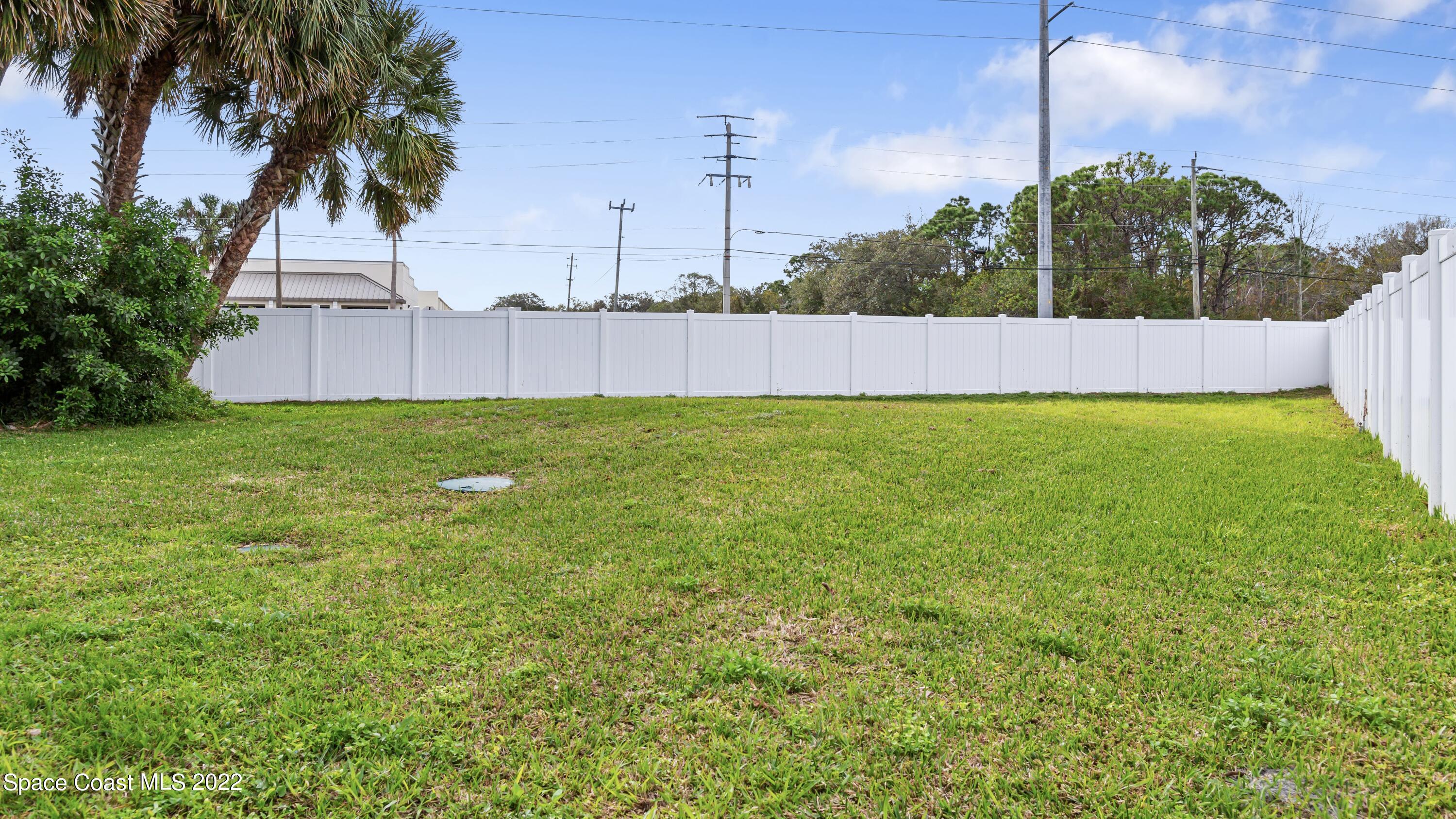 1709 Pinewood Road Melbourne, FL 32934 - Photo 35 of 38 a view of an outdoor space and a yard