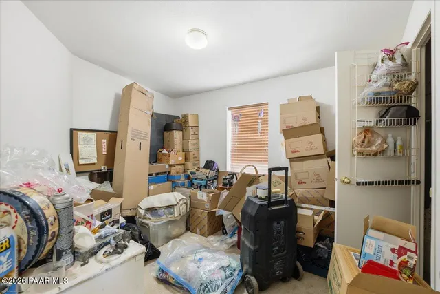 a view of a workspace with furniture