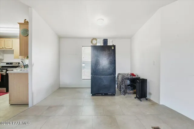 a view of an empty room with closet area