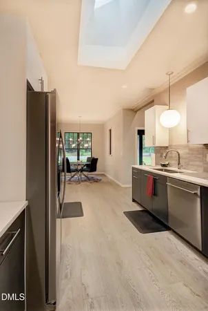 a spacious bathroom with a sink double vanity and a mirror