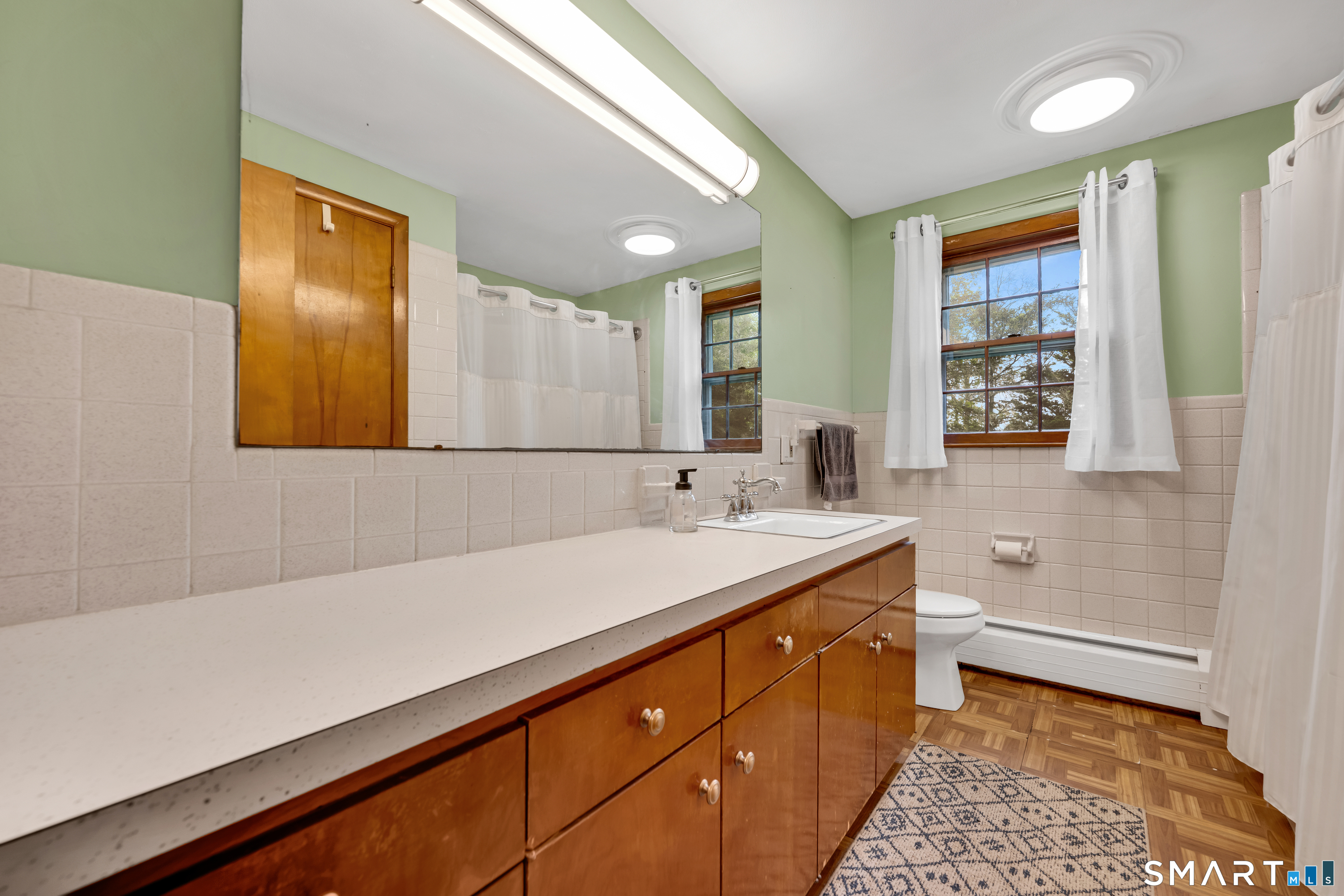 85 Timothy Road Naugatuck, CT 06770 - Photo 21 of 30 a bathroom with a sink a vanity and a large mirror