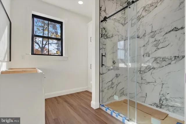 a bathroom with bathtub and shower