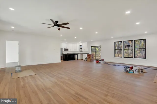 a view of a kitchen with a sink and a stove top oven