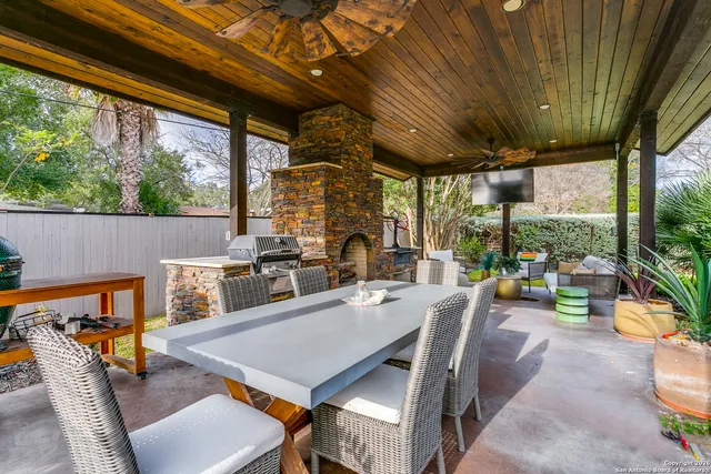 a outdoor dining space with furniture and outdoor view