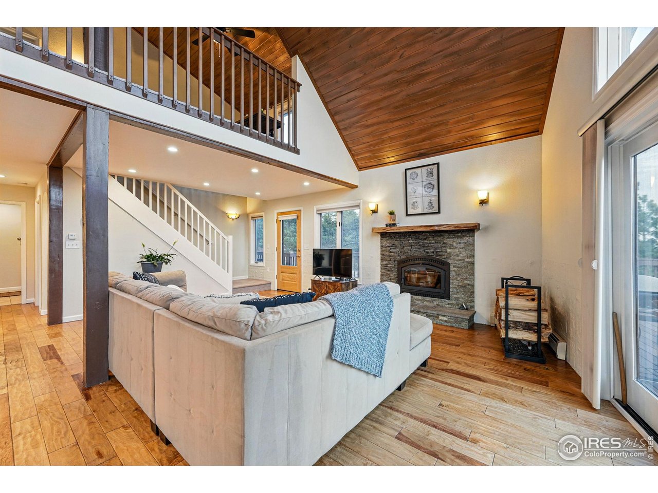 531 Sky Trail Road Boulder, CO 80302 - Photo 35 of 35 a living room with furniture and a fireplace