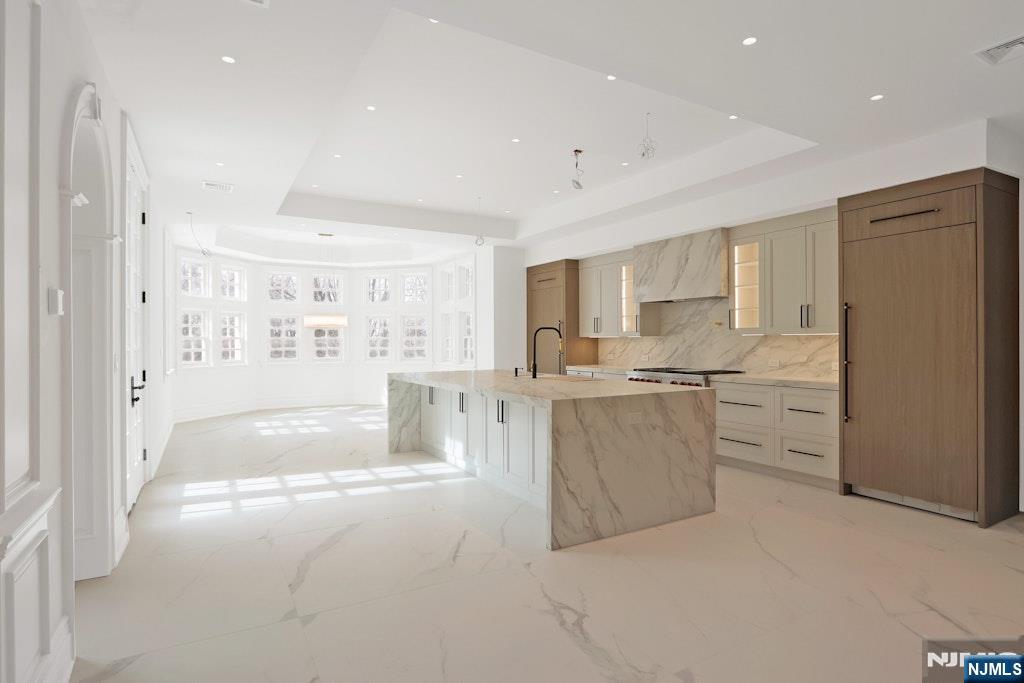 67 Robin Lane Alpine, NJ 07620 - Photo 15 of 40 a kitchen with white cabinets and refrigerator