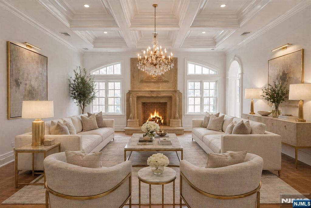 67 Robin Lane Alpine, NJ 07620 - Photo 24 of 40 a living room with furniture chandelier and a fireplace