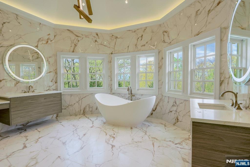 67 Robin Lane Alpine, NJ 07620 - Photo 33 of 40 a bathroom with a granite countertop sink and a large mirror