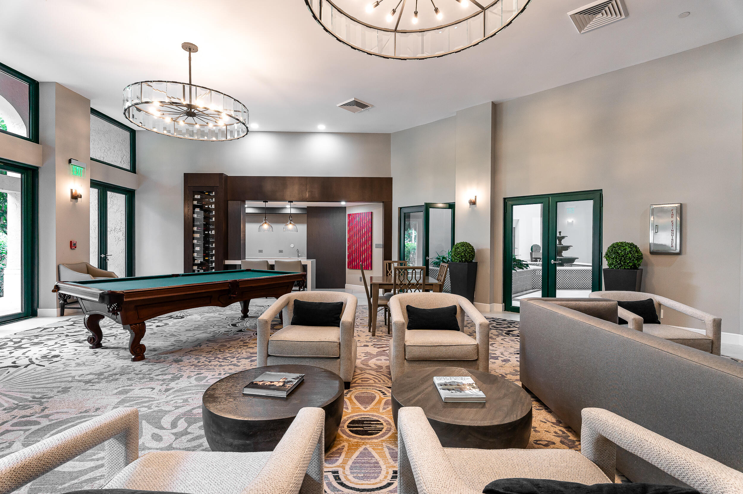 120 Southeast 5th Avenue, Unit 331 Boca Raton, FL 33432 - Photo 27 of 48 a living room with furniture a chandelier and a large mirror