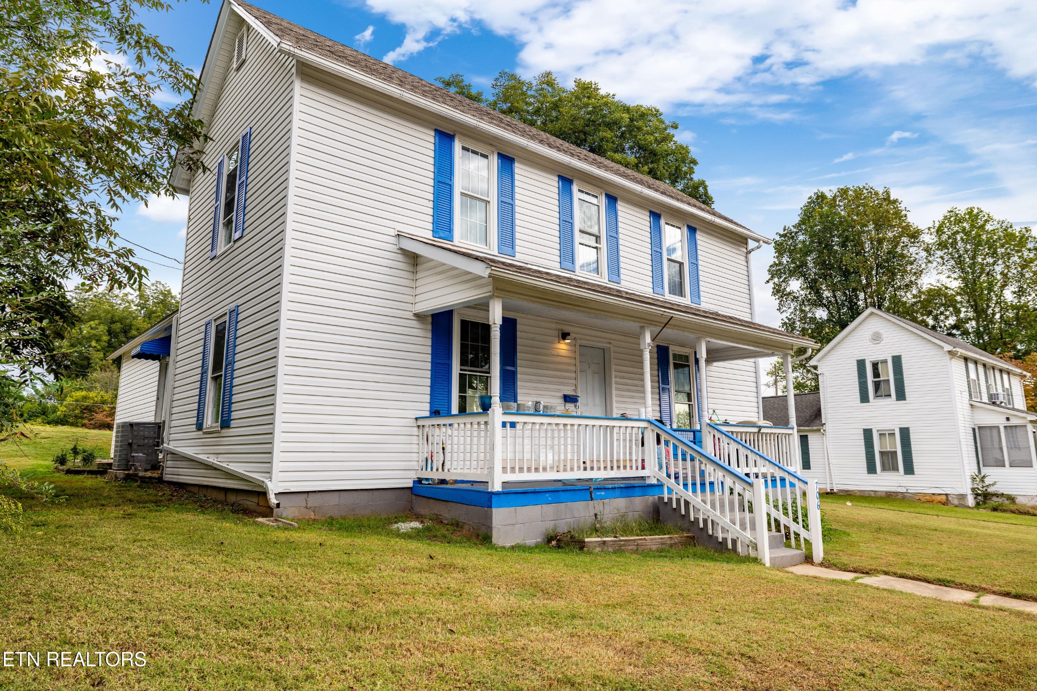 706 Broad Street Sweetwater, TN 37874 - Photo 2 of 28 a view of a house with a swimming pool
