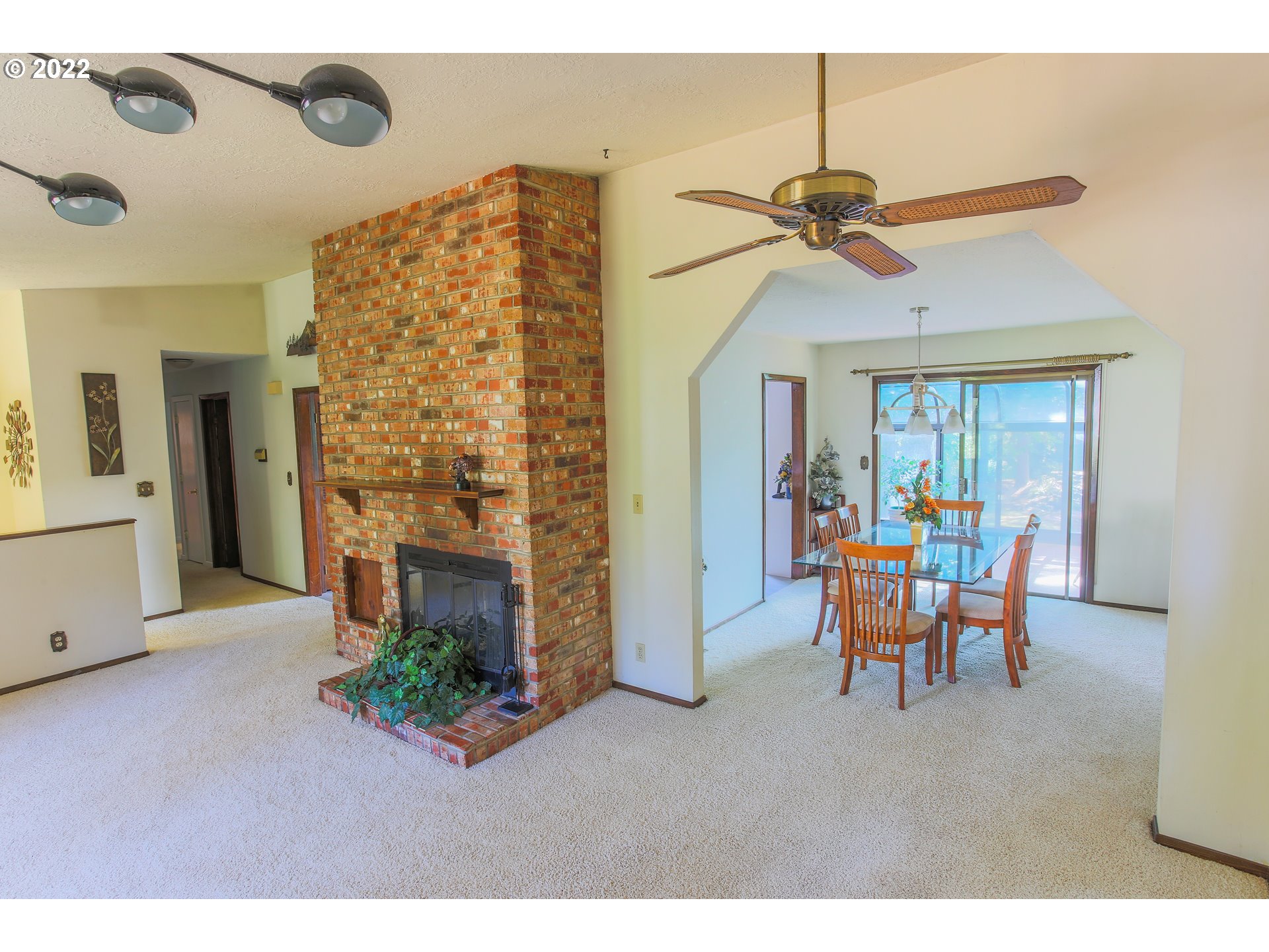 18173 Southeast Richey Road Gresham, OR 97080 - Photo 3 of 23 a living room with furniture and a fireplace