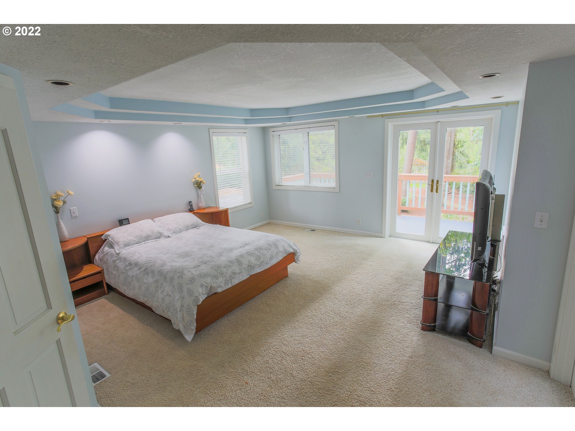 18173 Southeast Richey Road Gresham, OR 97080 - Photo 9 of 23 a bedroom with a large bed and a large window