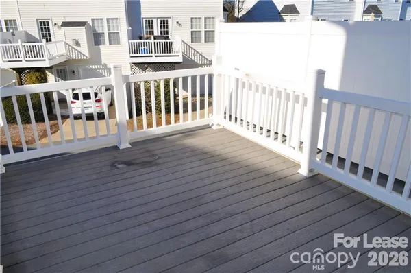 a view of a balcony with wooden floor