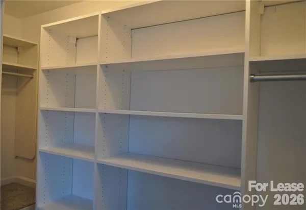 a view of an empty walk in closet
