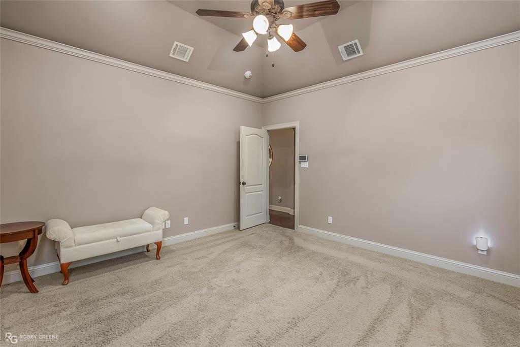 110 St Andrews Benton, LA 71006 - Photo 17 of 28 a living room with furniture and a chandelier