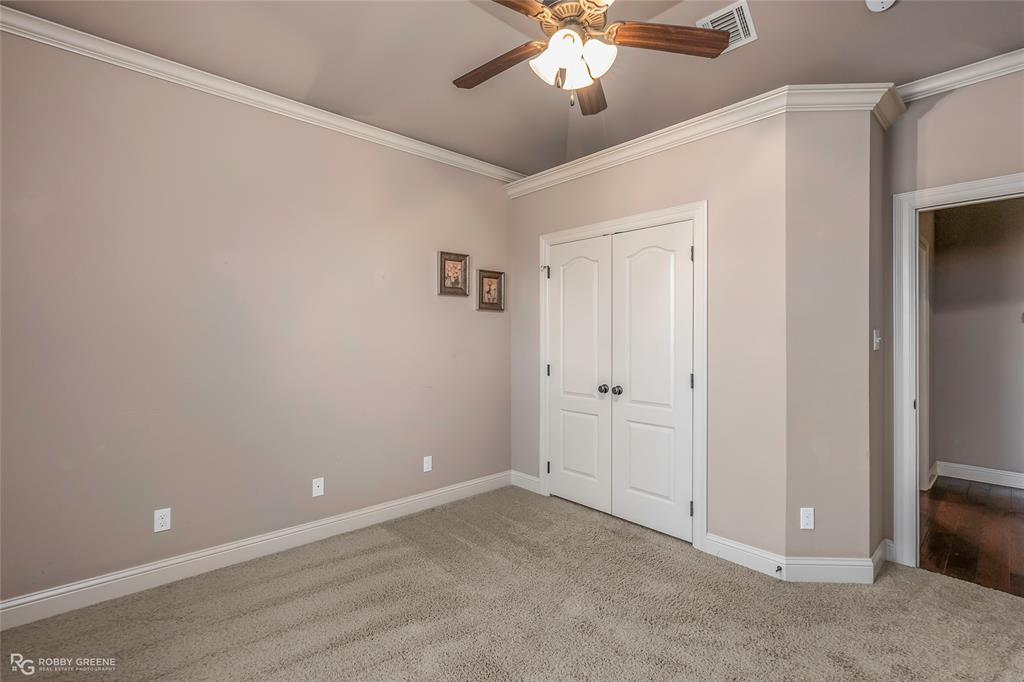 110 St Andrews Benton, LA 71006 - Photo 22 of 28 a view of an empty room with a chandelier fan