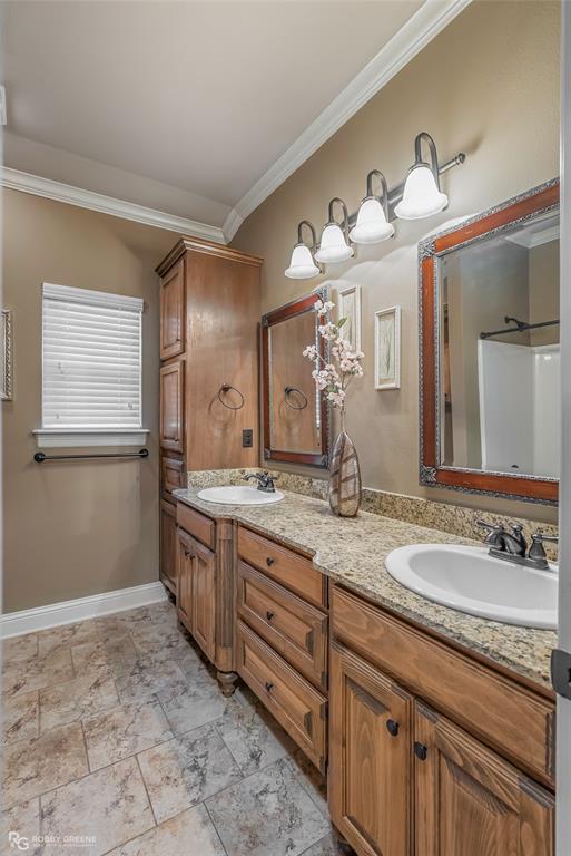 110 St Andrews Benton, LA 71006 - Photo 24 of 28 a bathroom with a granite countertop sink mirror and