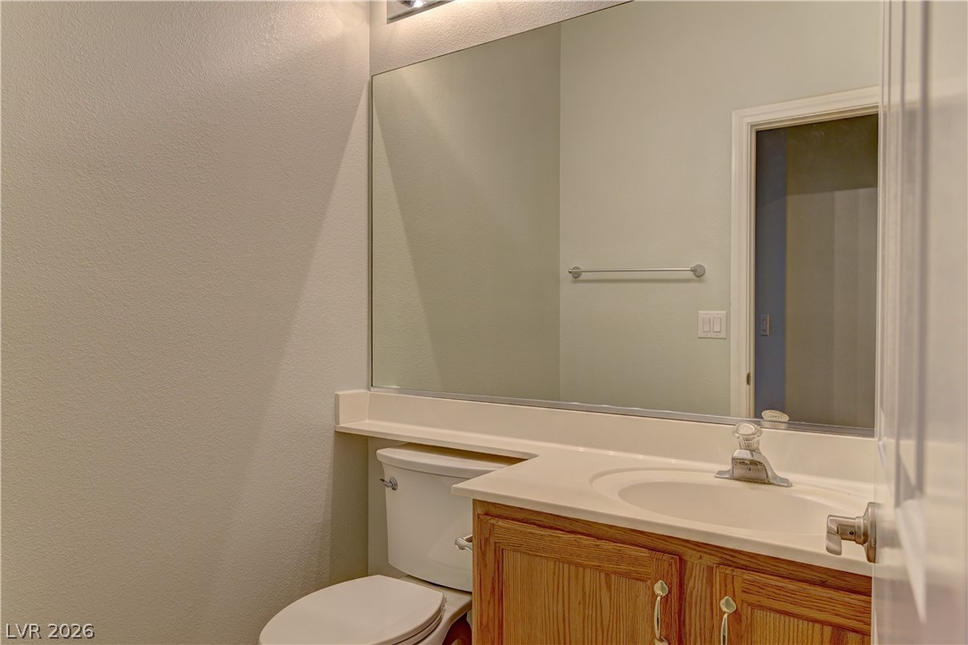 1813 Snow Spring Lane Las Vegas, NV 89134 - Photo 19 of 37 A well-appointed vanity with generous counter space awaits in this functional powder room.