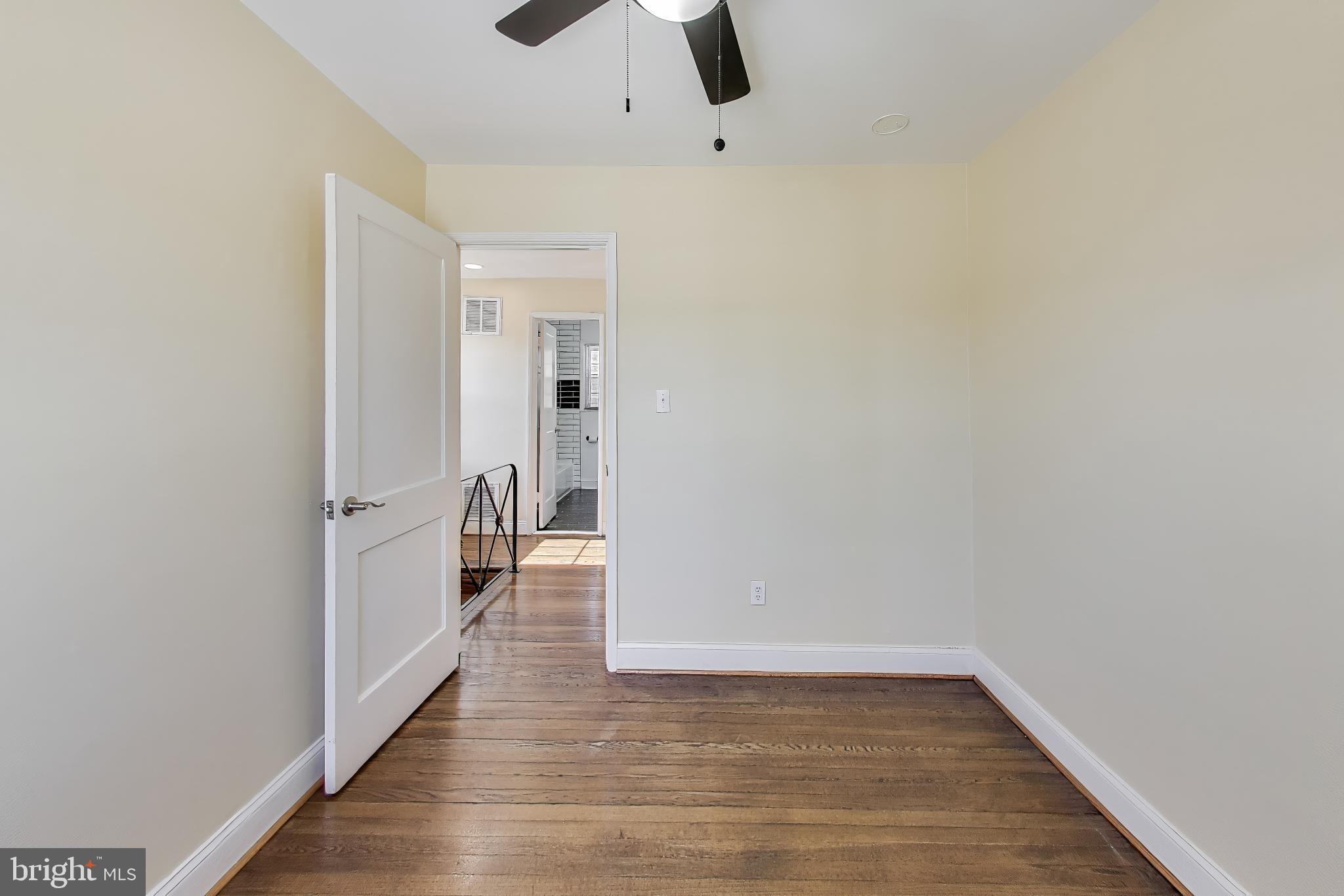 6904 Riggs Road Hyattsville, MD 20783 - Photo 19 of 34 a view of a room with wooden floor