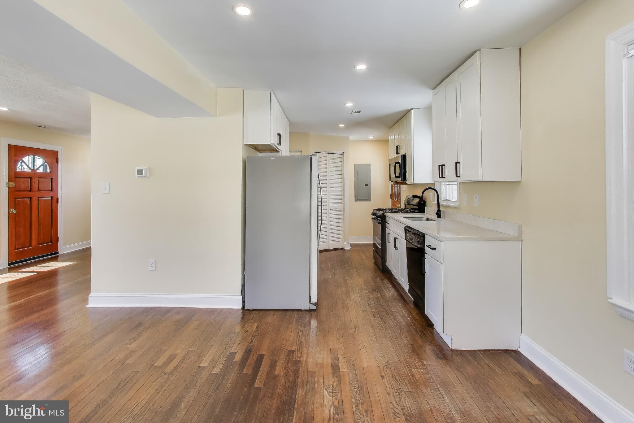 6904 Riggs Road Hyattsville, MD 20783 - Photo 6 of 34 a view of a kitchen with electric appliances