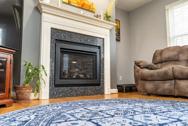 a bedroom with furniture and a flat screen tv