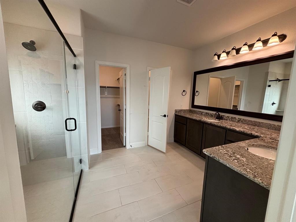 1080 Canuela Way Justin, TX 76247 - Photo 12 of 30 a view of a kitchen with a sink and cabinets
