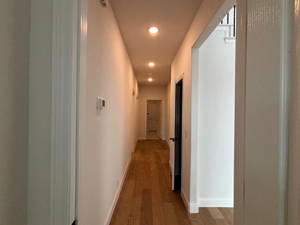 1080 Canuela Way Justin, TX 76247 - Photo 15 of 30 a view of hallway with wooden floor