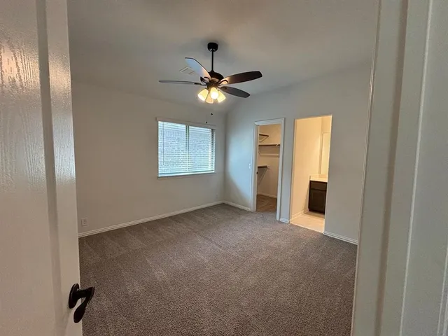 swimming pool view with a garden and seating area