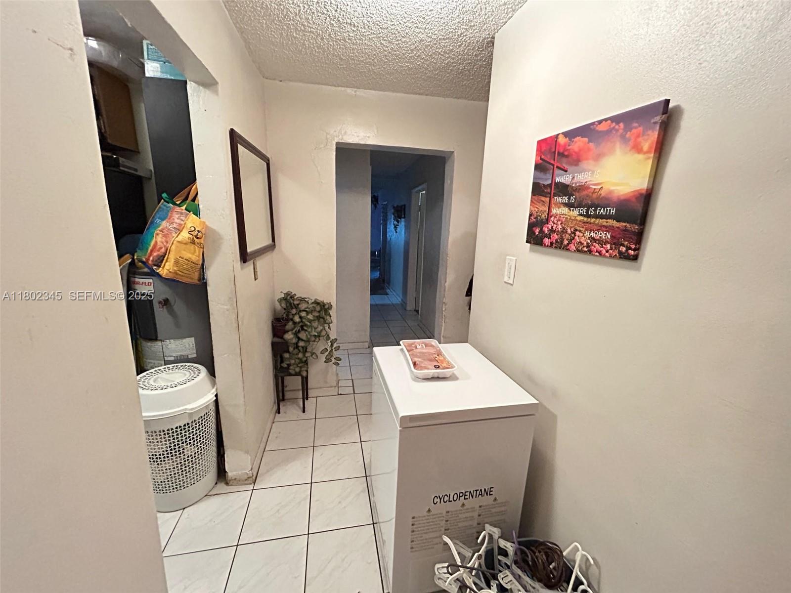 10354 Southwest 173rd Street Miami, FL 33157 - Photo 5 of 12 a bathroom with a toilet a sink and mirror