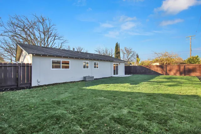 a backyard of a house with lots of green space