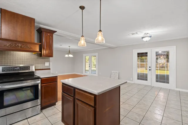 a kitchen with a stove and a sink