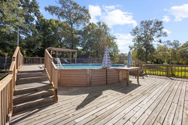 a view of a swimming pool with a lake view and sitting space
