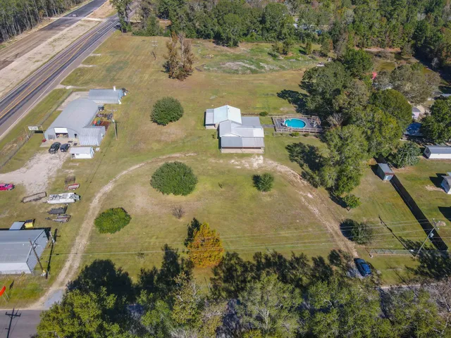 an aerial view of residential house with outdoor space