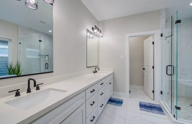 a bathroom with a bathtub and a shower