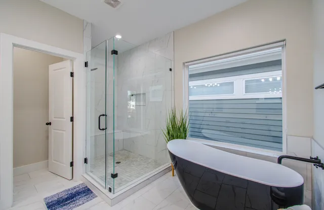 a bathroom with a granite countertop sink mirror and double