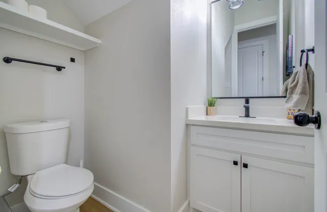 a view of kitchen with cabinets and wooden floor