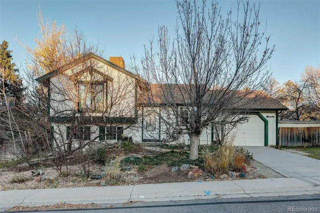 a view of a trees in front of a house