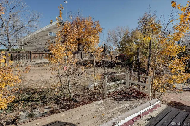 a view of a backyard of the house