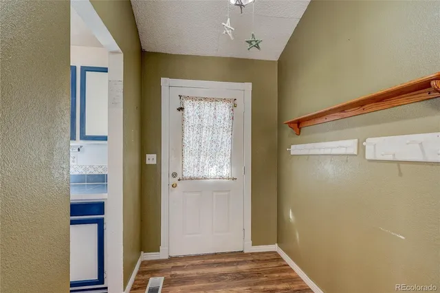 a view of bedroom and front door