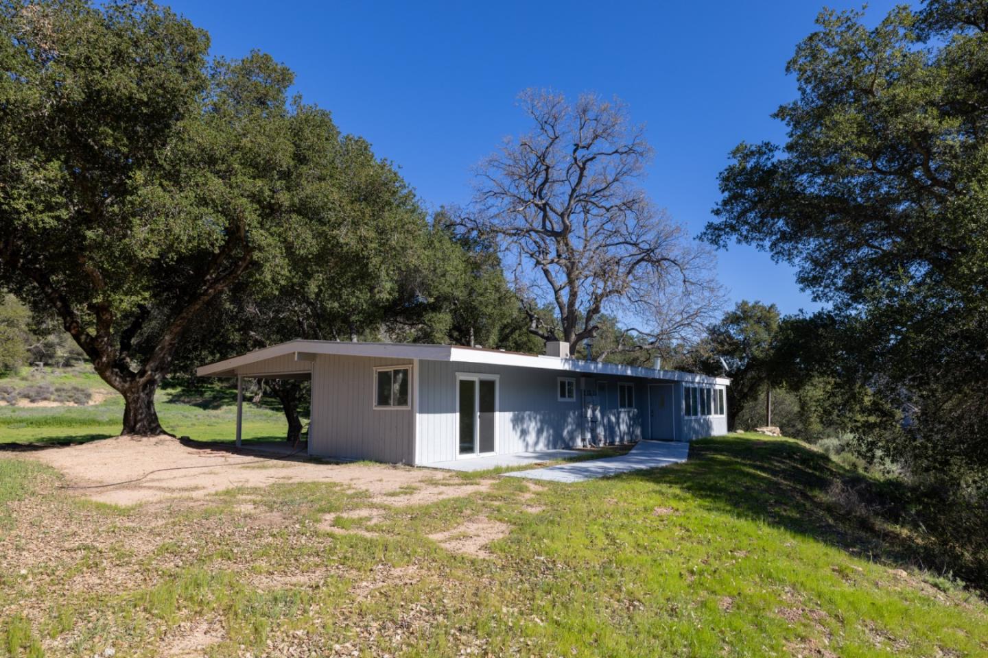 47292 Arroyo Seco Road Greenfield, CA 93927 - Photo 11 of 37 a view of a house with a yard and large tree