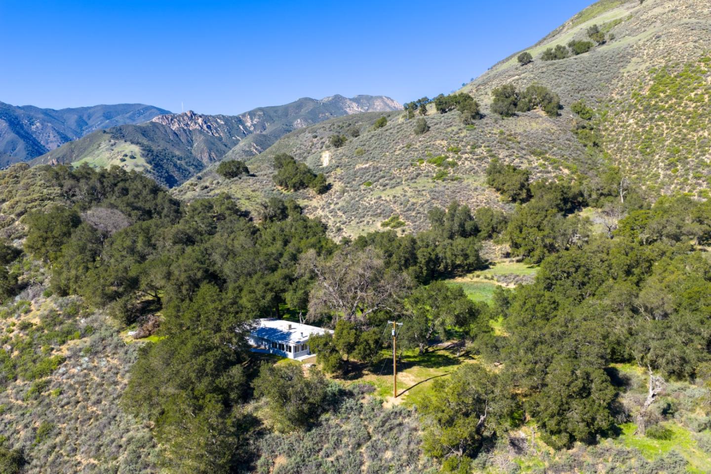47292 Arroyo Seco Road Greenfield, CA 93927 - Photo 37 of 37 a view of a building with a mountain and mountains in the background