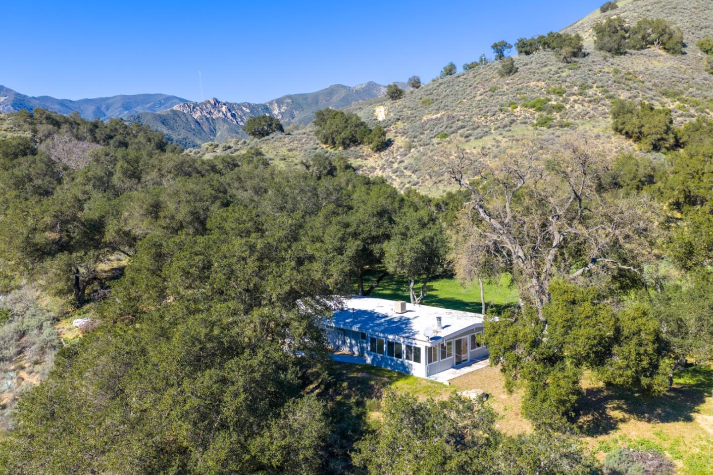 47292 Arroyo Seco Road Greenfield, CA 93927 - Photo 4 of 37 a picture of a building with a mountain in the background