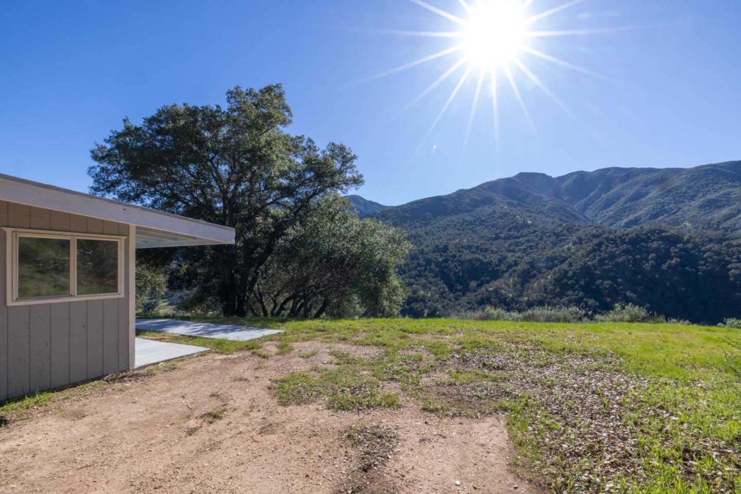 47292 Arroyo Seco Road Greenfield, CA 93927 - Photo 9 of 37 a view of a house with a yard and a large tree