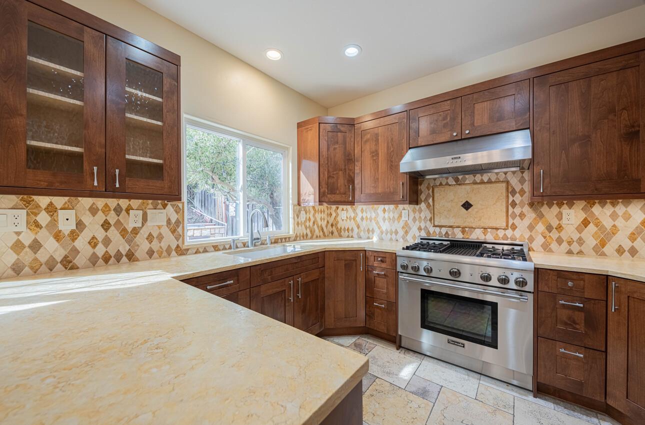 18050 Stonehaven Salinas, CA 93908 - Photo 12 of 32 a kitchen with a stove top oven sink and cabinets