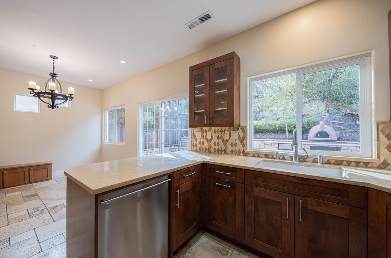 18050 Stonehaven Salinas, CA 93908 - Photo 14 of 32 a kitchen with a sink and a window