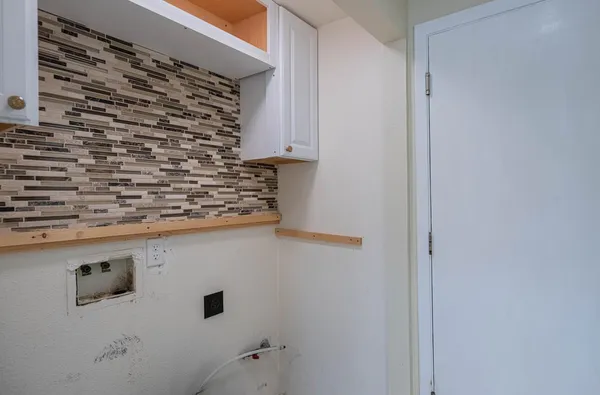 a bathroom with a shower and a sink