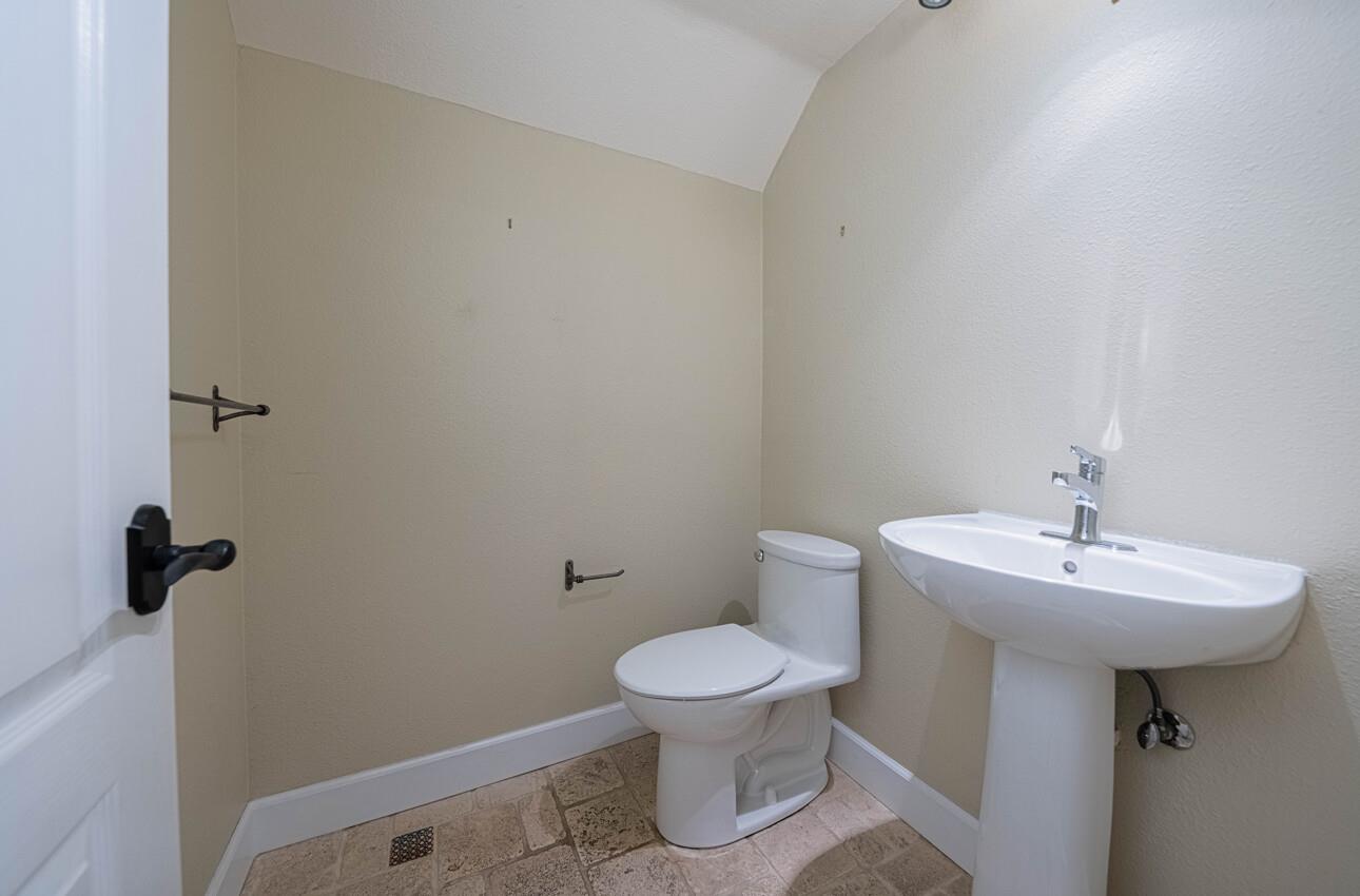 18050 Stonehaven Salinas, CA 93908 - Photo 22 of 32 a bathroom with a sink toilet and a mirror